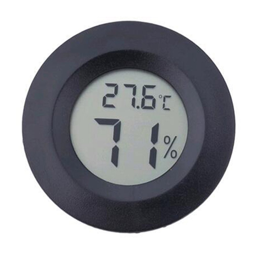 Compact round electronic thermometer and hygrometer for outdoor sports and camping.